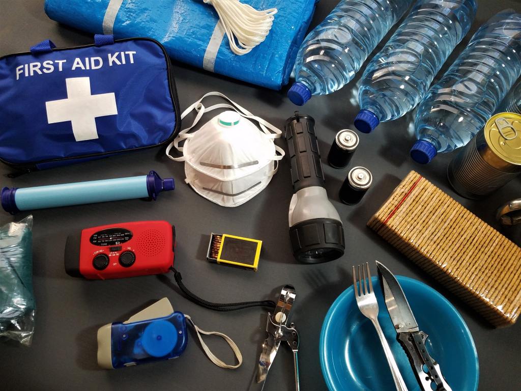 Survival kit items placed on a table.