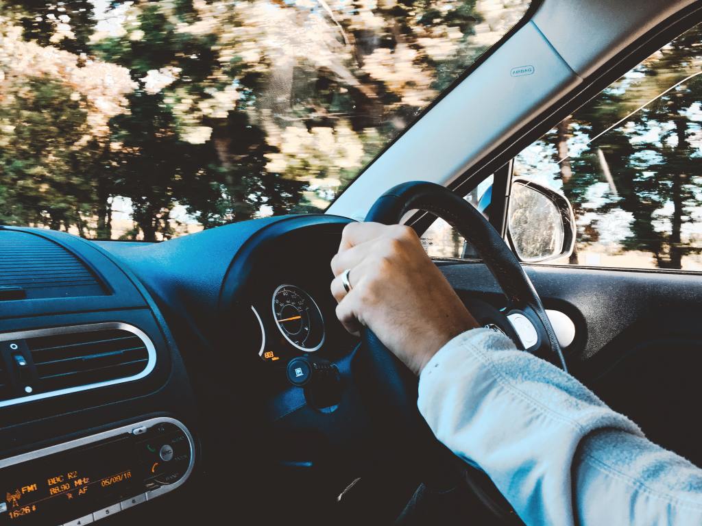A person driving a car.