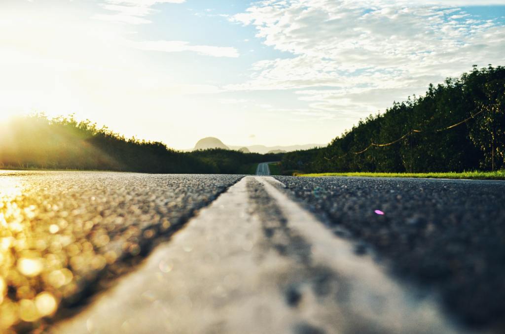 A road surrounded by various hills.
