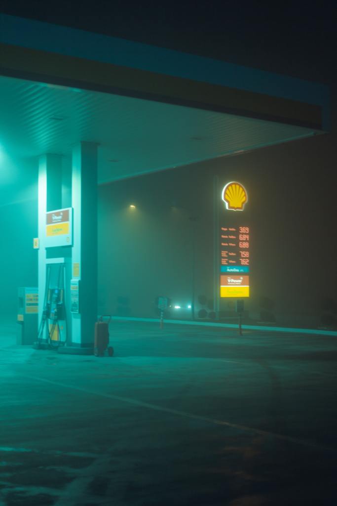 A foggy gas station at night.